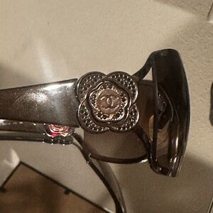 CHANEL Black Sunglasses with Silver Floral Detail